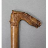 An early 20th century Greek hardwood walking cane with carved horses-head & male head handle &