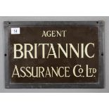 A brass rectangular plaque “AGENT BRITANNIC ASSURANCE CO LTD” 8” x 12½”, in glazed frame.
