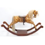A DAVID TIMBERLAKE “HORSES OF TROY” SERIES WOODEN ROCKING HORSE, 60” long x 37” high.