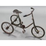 An early/mid-20th century child's tricycle with solid rubber wheels. (lacking chain).