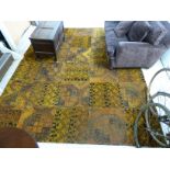 A Kelim carpet with repeating stylised design on a burnt orange coloured ground 130'' x 102''