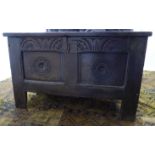 A late 18thC oak coffer with a twin panelled front, a lunette carved frieze and a twin panelled,