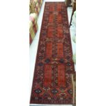 A modern Massoull machine made runner with repeating designs,