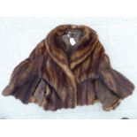 A brown coloured mink cape SR
