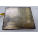 An Indian silver coloured, metal folding cigarette case with engine turned decoration,