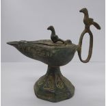 An 'antique' Aladdin style cast metal oil lamp 11