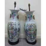 A pair of mid 20thC Chinese porcelain vase design table lamps of baluster form with opposing