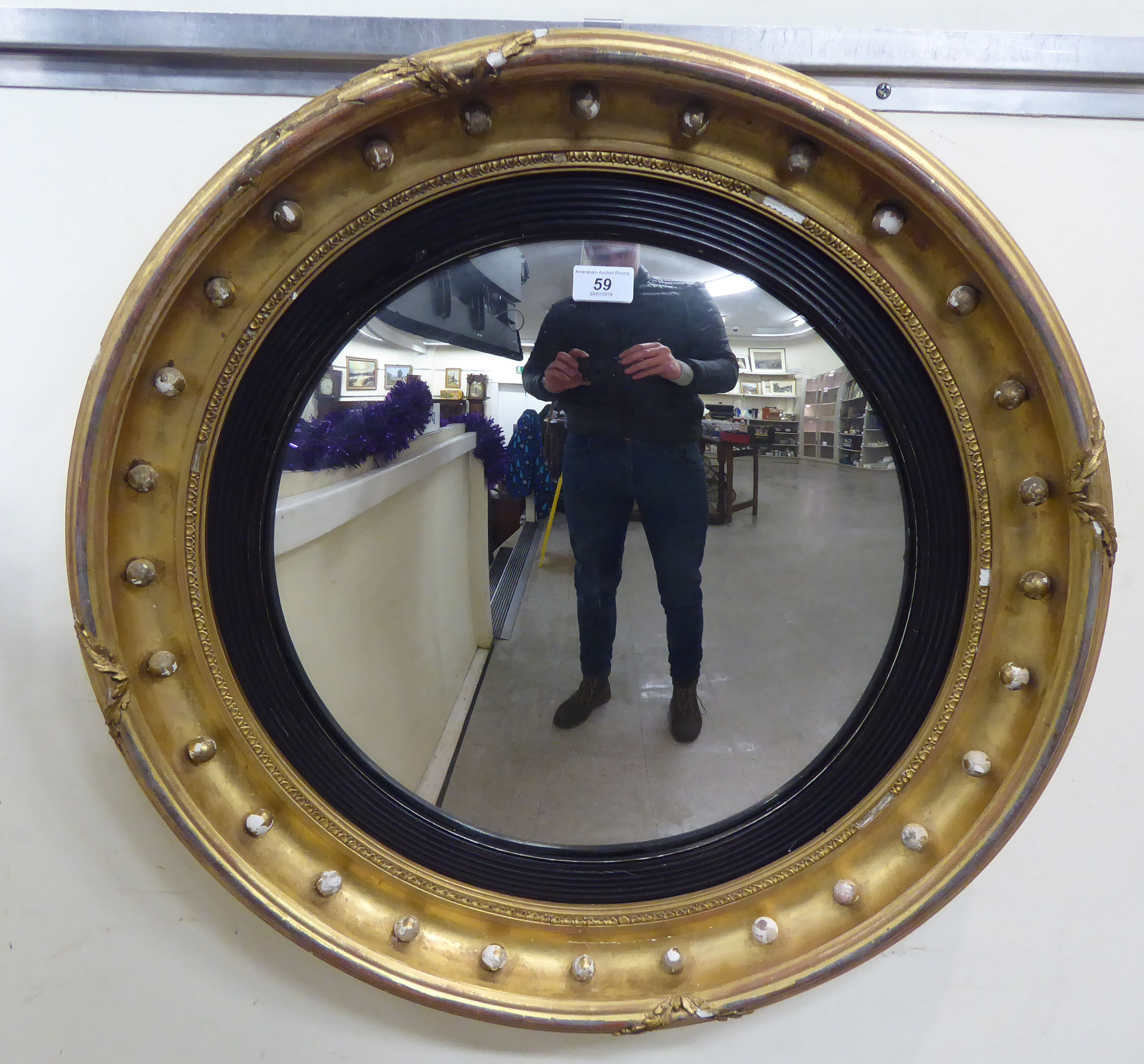 An Edwardian Regency style convex mirror,