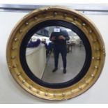 An Edwardian Regency style convex mirror,