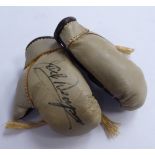 A pair of miniature two-tone brown leather boxing gloves,
