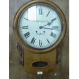 A late 19th/early 20thC light oak cased, drop dial wall clock with a turned surround,