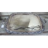 An early 20thC silver plated twin handled and engraved serving tray with a raised,