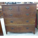 A late Victorian oak five drawer dressing chest,