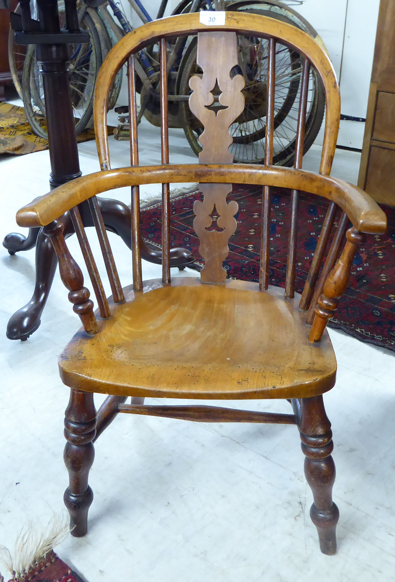 A late Victorian child's beech and elm framed Windsor design chair,