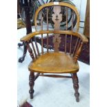 A late Victorian child's beech and elm framed Windsor design chair,