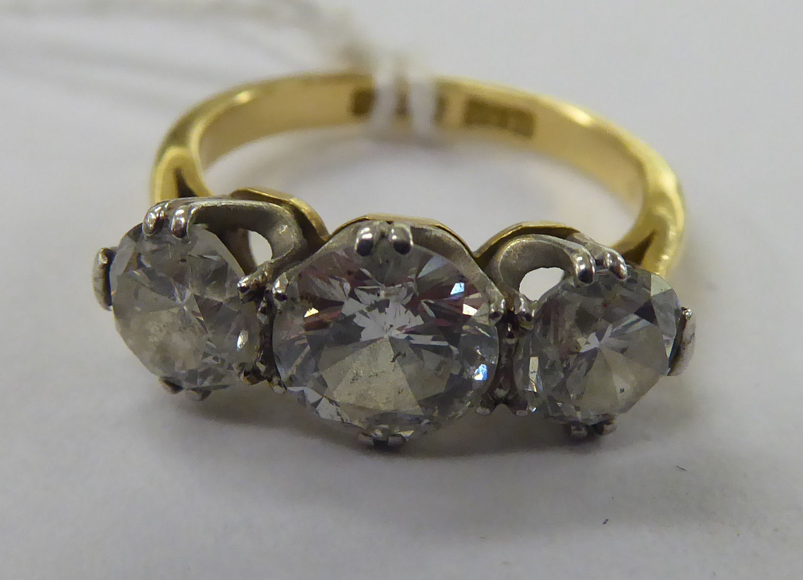 An 18ct gold and platinum three stone,