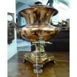A late Victorian copper and brass samovar with opposing, scrolled handles,