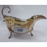 A silver sauce boat,