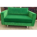A modern emerald green fabric upholstered two person studio settee,