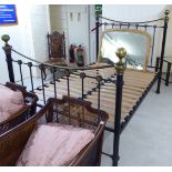 A modern Victorian style black enamelled steel and lacquered brass bed frame with a railed head and