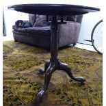 A George III mahogany pedestal table with a tip-top, raised on a splayed tripod base,