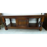 An Old Charm stained oak coffee table, raised on baluster and block legs, united by an undershelf,