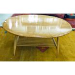 An Ercol elm and beech coffee table, the oval top raised on a splayed,
