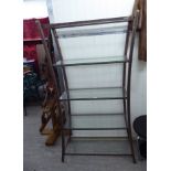 A Pierre Vandel speckled bronze finished, steel framed display unit of waisted form,