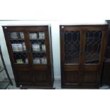 A pair of Old Charm stained and carved oak cabinet bookcases,