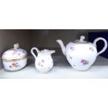 A modern Meissen porcelain teapot of ovoid form with a naturalistically moulded spout and handle,