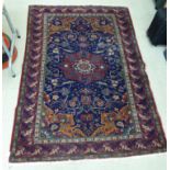 A Persian rug with floral and other designs,