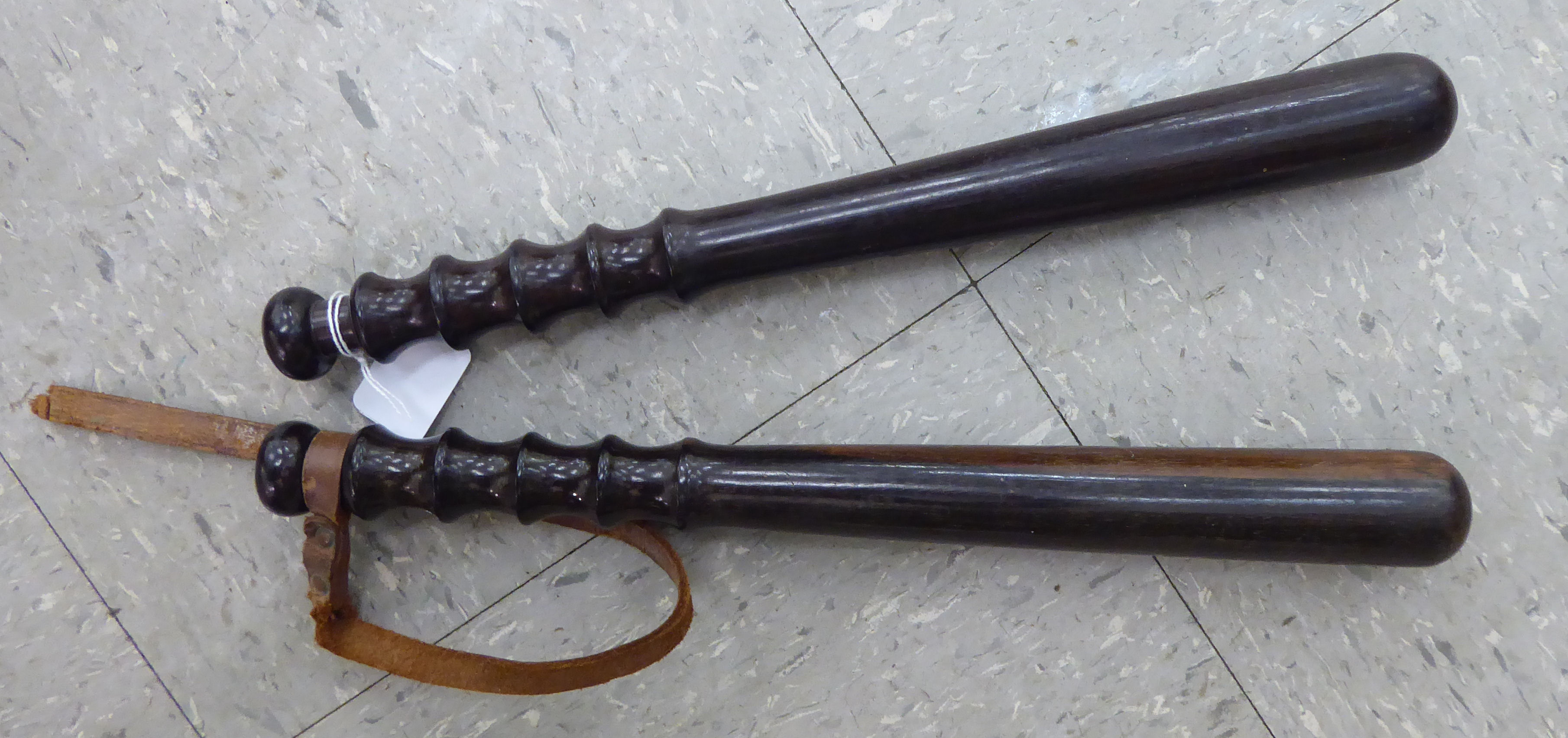 Two similar early 20thC turned fruitwood truncheons with ribbed handles each 16''L OS5