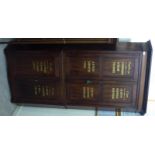 A late Victorian mahogany, two-part, standing corner cupboard, comprising two pairs of doors,