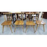 A set of four Ercol light coloured beech and elm framed kitchen chairs with curved bar crests and