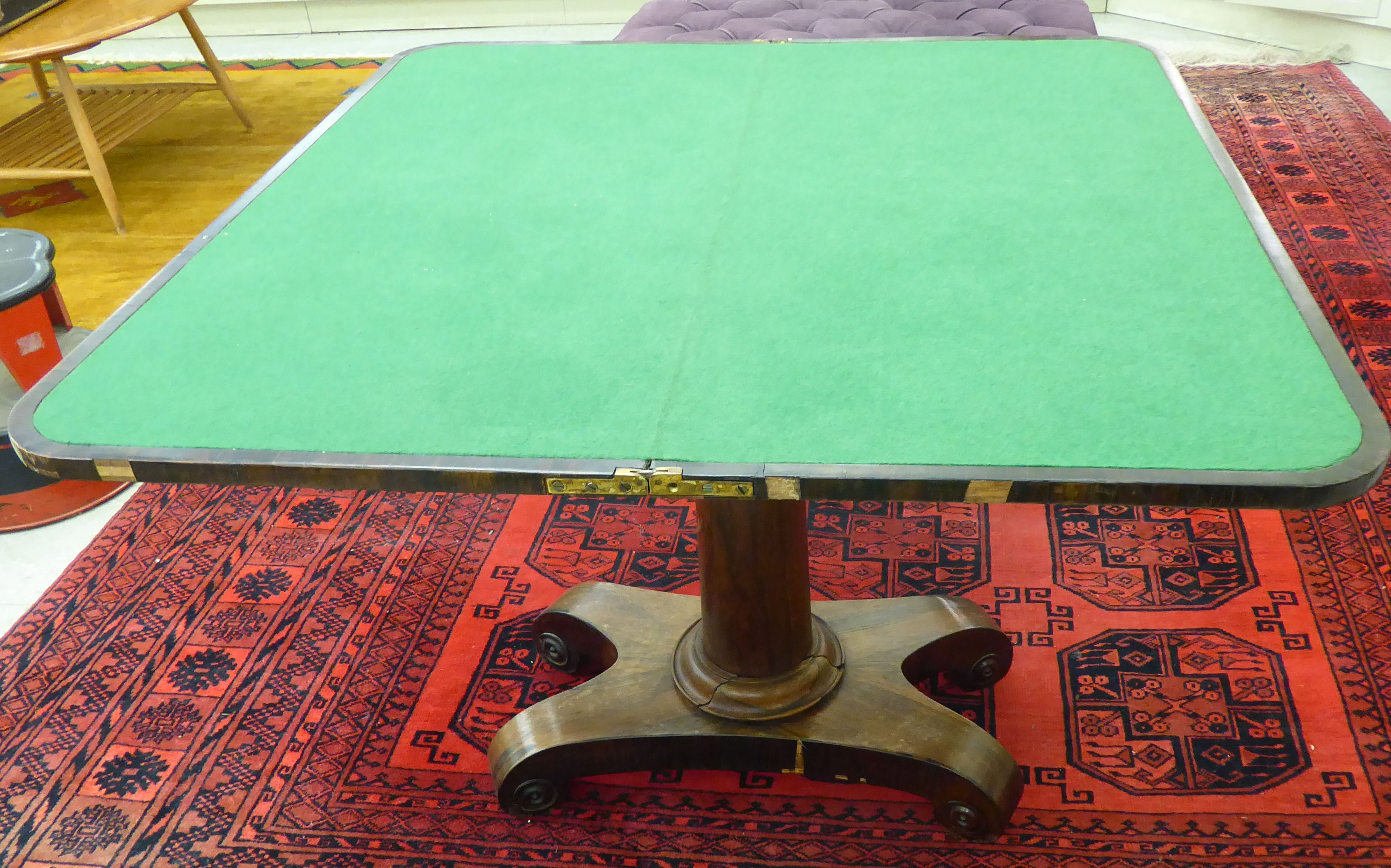 A Regency rosewood card table with a foldover top, enclosing a baize lined interior, - Image 2 of 2