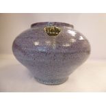 An American Unaca Art Pottery high fired, lilac coloured vase of ribbed,