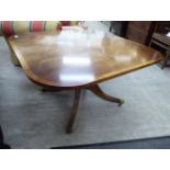 A modern Regency style mahogany coffee table, the flame veneered top with a crossbanded border,