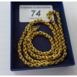 A gold coloured metal ropetwist necklace stamped AG 11
