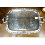An early 20thC silver plated twin handled and engraved serving tray with a raised,