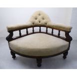 A mid Victorian stained walnut showwood framed salon corner chair, the part-button upholstered back,