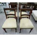 A set of four late Victorian/Edwardian mahogany framed, floral carved, bar back dining chairs,