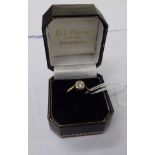 An 18ct gold diamond and solitaire ring 11