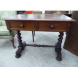A mid Victorian mahogany writing table, the top with a moulded edge, over two frieze drawers,