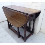 A late 18thC provincial oak gateleg table, the oval top with an end drawer and shaped apron,