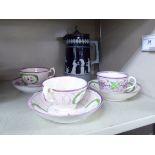 A set of three late 18th/early 19thC porcelain tea cups and saucers,
