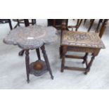 Small furniture: to include an early/mid 20thC profusely carved Indonesian teak occasional table,