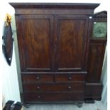 A mid Victorian mahogany linen press with two panelled doors, two short/two long drawers,