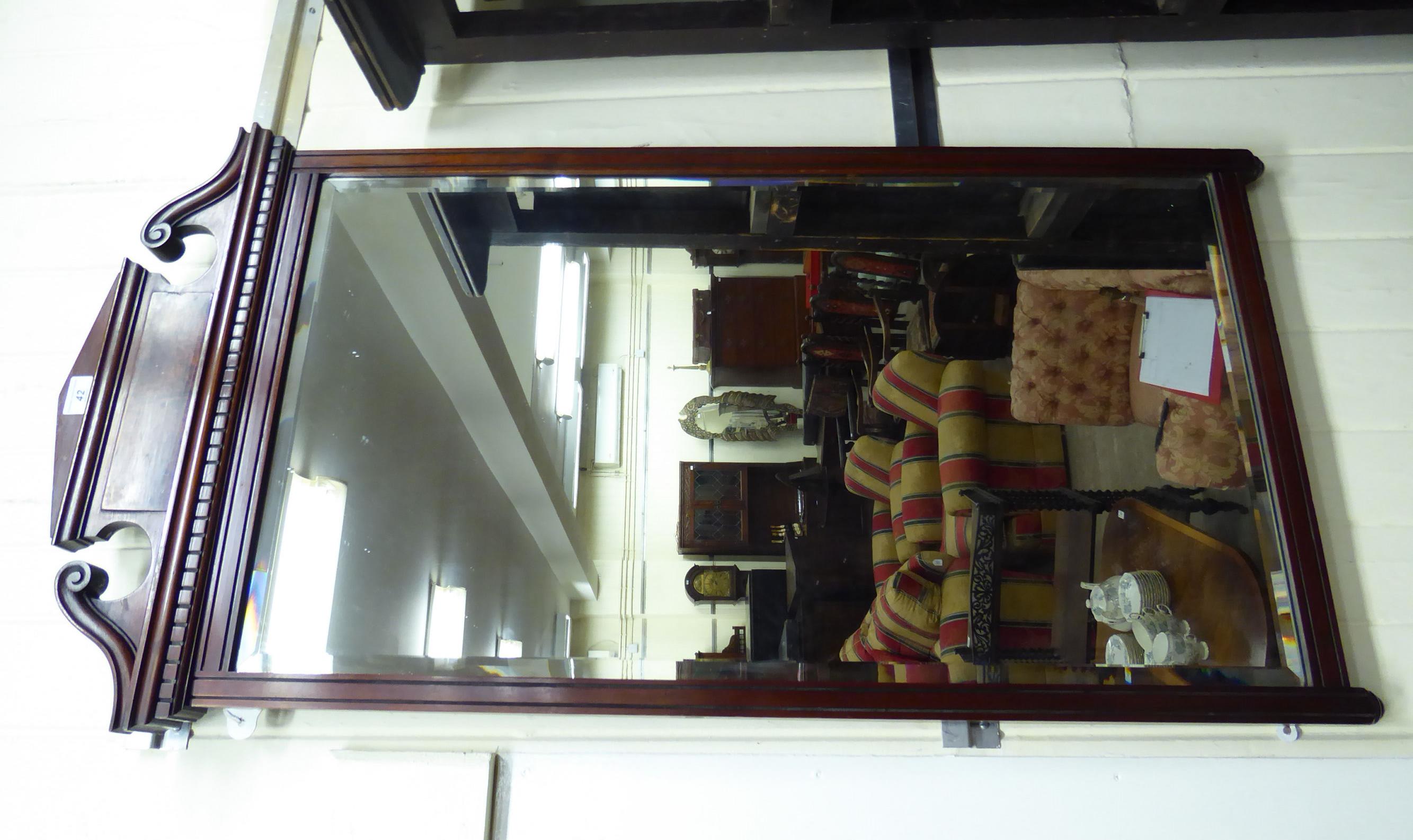 An Edwardian bevelled mirror,