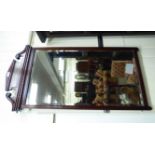 An Edwardian bevelled mirror,