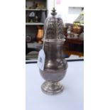 A silver caster of baluster form,